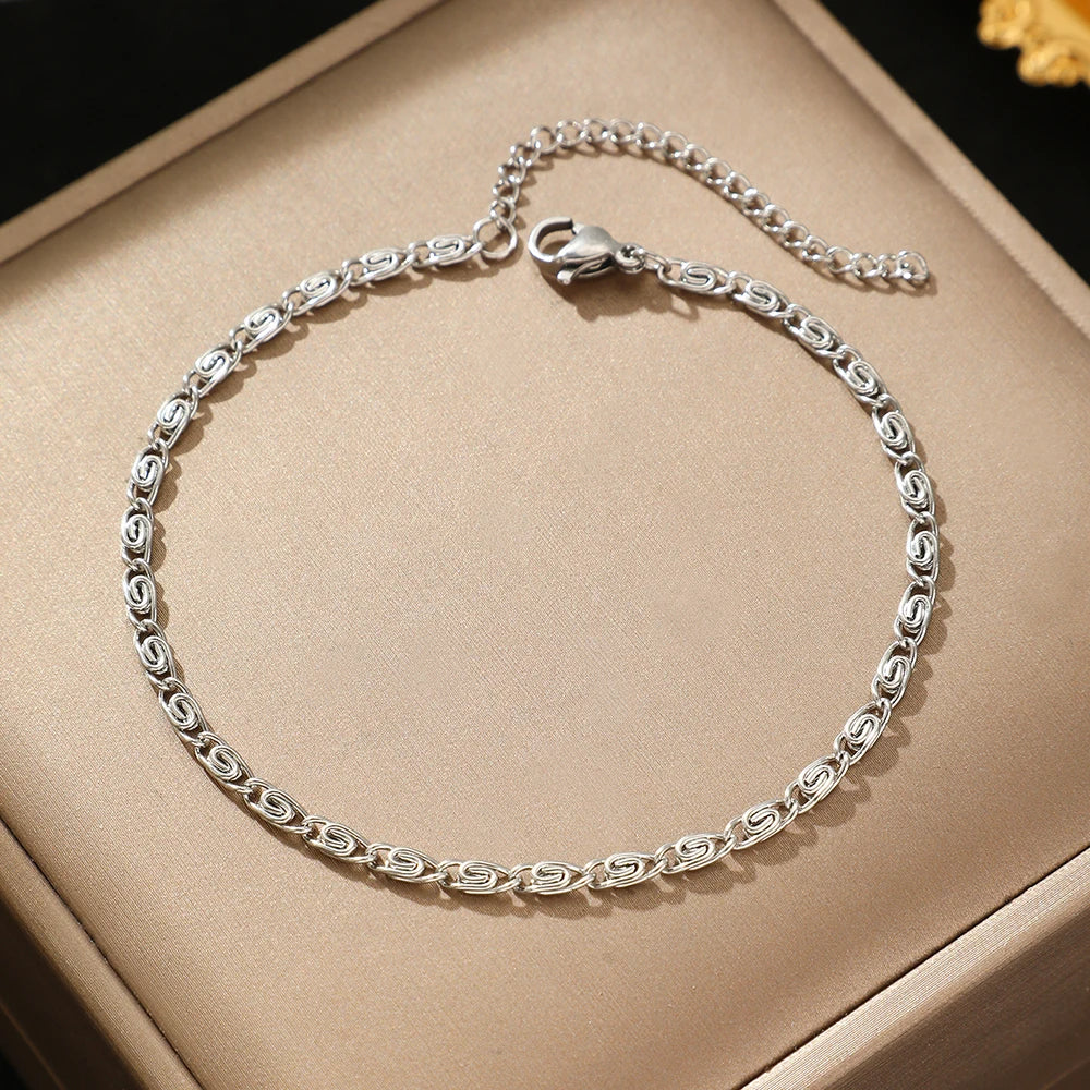 A dainty silver anklet with a simple chain link design.