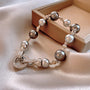 An elegant bracelet with white and golden south sea pearls and a crystal clasp.