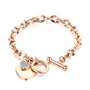 Rose Gold-toned chain bracelet with a dangling heart charm adorned with crystals